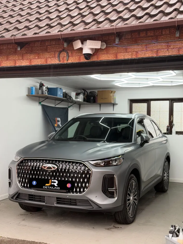 Matte grey SUV in the J.R Detailing unit
